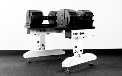 White REP® Adjustable Dumbbell Stand holding REP® x PÉPIN™ adjustable dumbbells