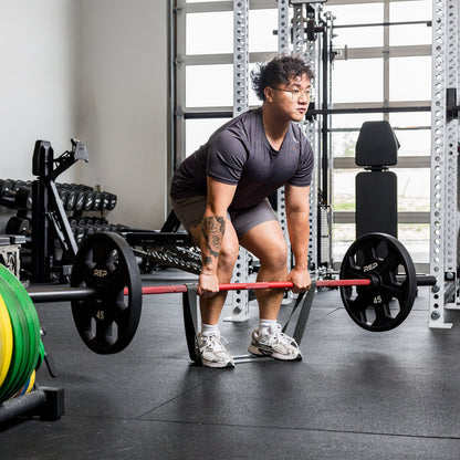 Athlete using the REP Fitness Resistance Bands 2.0 in assisted deadlift