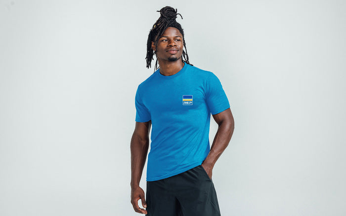 The REP Fitness Rise Tri-Blend Crew T-Shirt in Heather Royal/Blue front, on model