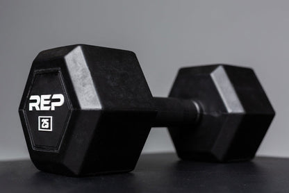 Angled view of a 25lb Rubber Coated Hex Dumbbell showing off the white "REP" logo and weight marking.