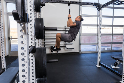 Athlete using the REP Fitness Shackle attached to a PR-5000 crossmember with a rope attachment