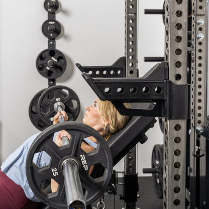 Athlete doing incline bench with the short Spotter Arms 2.0 set up to use as a place to rack the bar