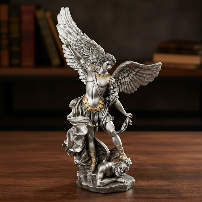 Statue of an angel with outstretched wings on a wooden surface