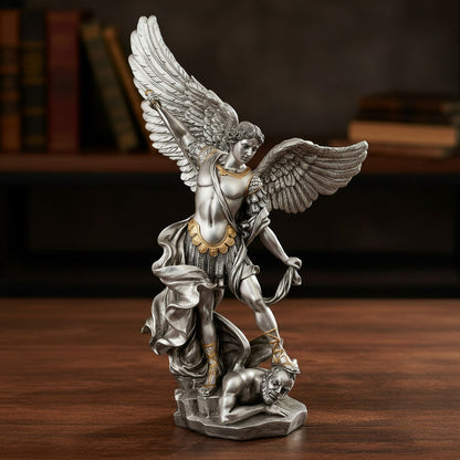 Statue of an angel with outstretched wings on a wooden surface