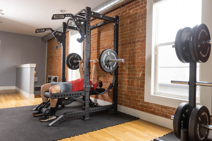 Strap Safeties on a PR-4000 Power Rack Being Used For Bench Press in a Home Gym