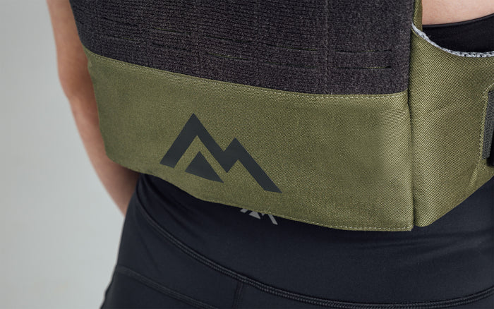 Mountain logo on the back bottom of the Strata Weight Vest