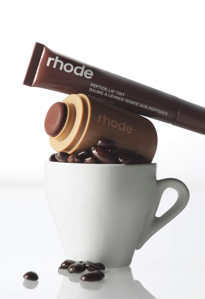 espresso plt and toasted teddy blush on top of a cup filled with coffee beans
