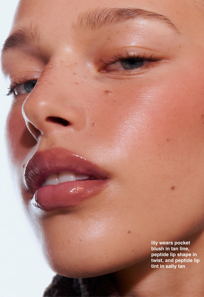 lily wears pocket blush in tan line, peptide lip shape in twist, and peptide lip tint in salty tan