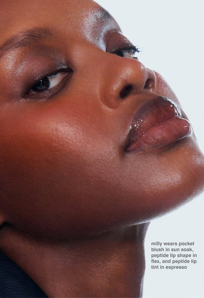 milly wears pocket blush in sun soak, peptide lip shape in flex, and peptide lip tint in espresso