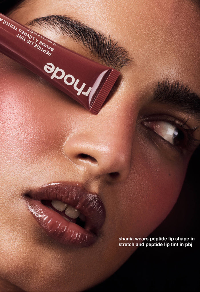 Shania wears peptide lip shade pin stretch and peptide lip tint in pbj
