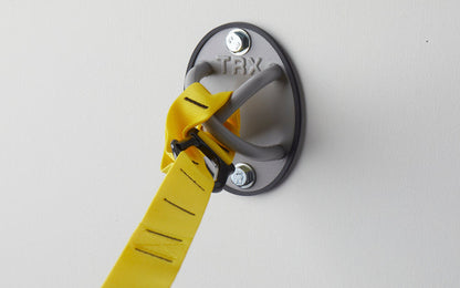 Close-up: A TRX Suspension Trainer™ attached to a TRX X-Mount® mounted on a wall