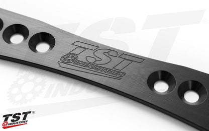 Features a subtle TST logo on the bracket.