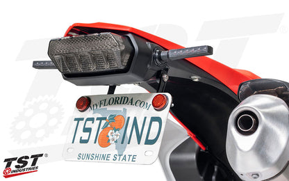 Removes the oversized stock fender.