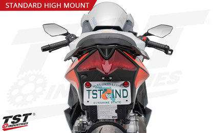 Mount your license plate in a fixed position high mount location similar to stock, just without the extra bulk.