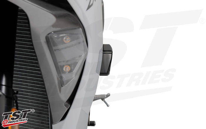 Robust delrin sliders provide initial impact absorption and provide a sacrificial sliding surface.