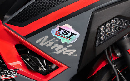 Upgrade your bike with a holographic TST sticker.