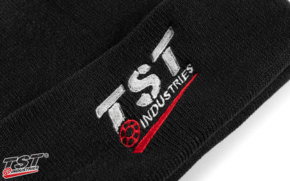 Embroidered TST Industries logo.