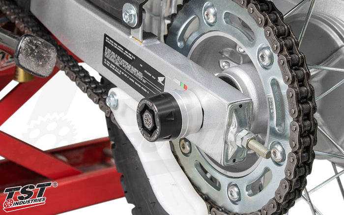 Protect your Honda XR150L with TST Industries Rear Axle Sliders.