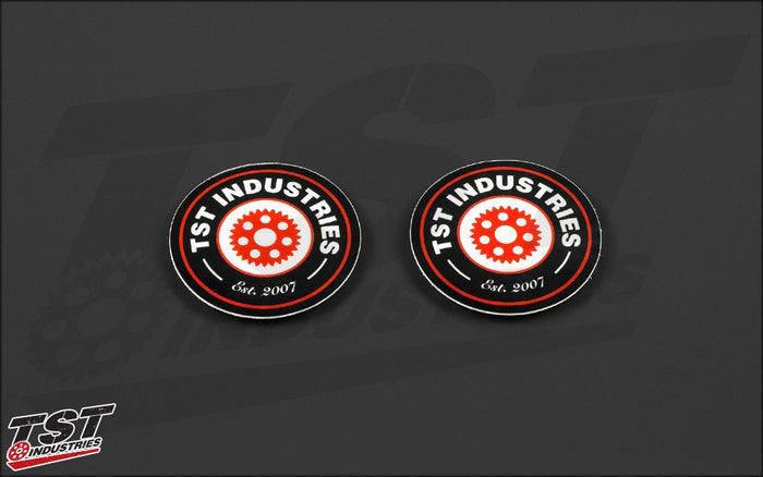 Black round TST logo sticker. Measures 2 inches in diameter.
