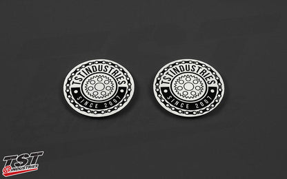 White round TST emblem sticker. Measures 2 inches in diameter.