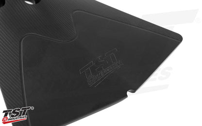 Subtle engraved TST iconography.