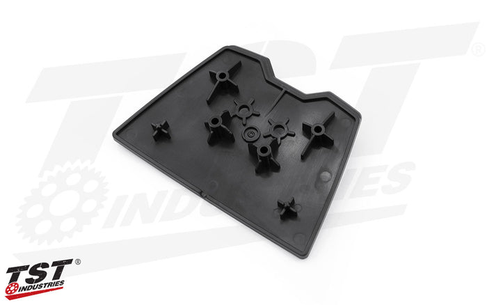 ABS injection molded construction matches the surrounding Undertail panel for a factory finish.