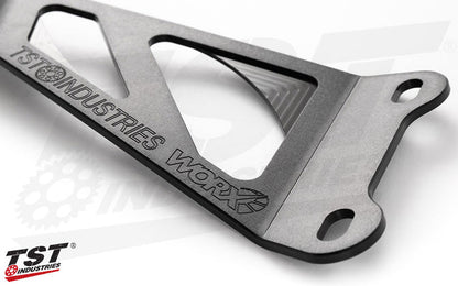 TST WORX subtle engraved iconography.