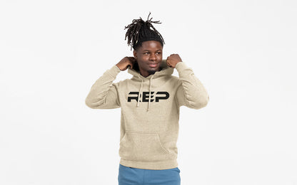 The REP Fitness Unisex Daily Driver 2.0 Pull Over Hoodie in Heather Stone/Black front, adjusting hood