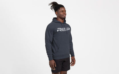 The REP Fitness Unisex Daily Driver 2.0 Pull Over Hoodie in Heather Navy/Silver front, side angle