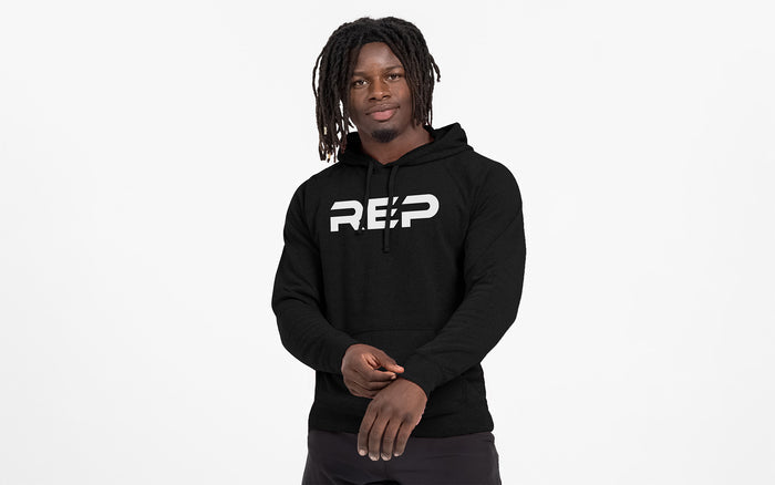 The REP Fitness Unisex Daily Driver 2.0 Pull Over Hoodie in Black/White front, on model