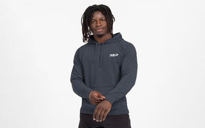 The REP Fitness Unisex USA Pull Over Hoodie in Heather Navy/White front, on model