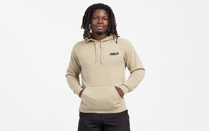 The REP Fitness Unisex USA Pull Over Hoodie in Heather Stone/Black front, hood down, hands in pockets