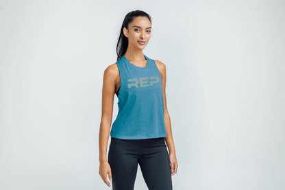 The REP Fitness Women's Daily Driver Cropped Dual-Blend Tank in Heather Teal/Aqua Gray on body