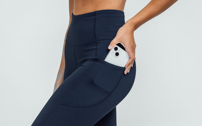 The REP Fitness Women's Hera Legging in Navy on body, side pocket detail