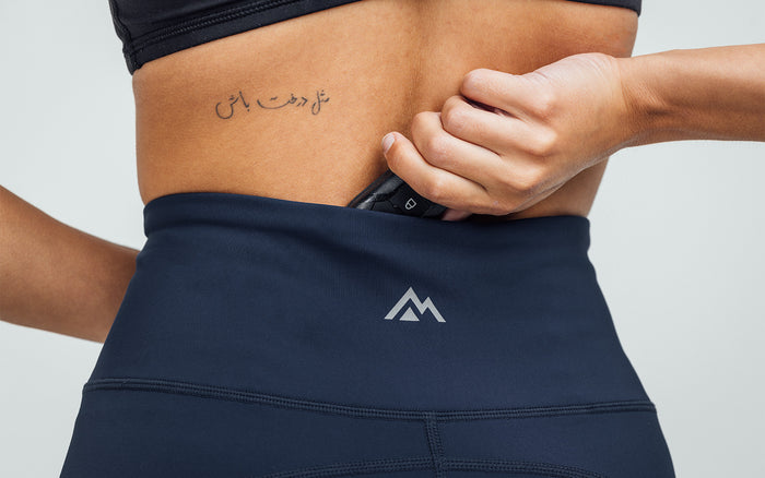 The REP Fitness Women's Hera Legging in Navy on body, rear pocket detail