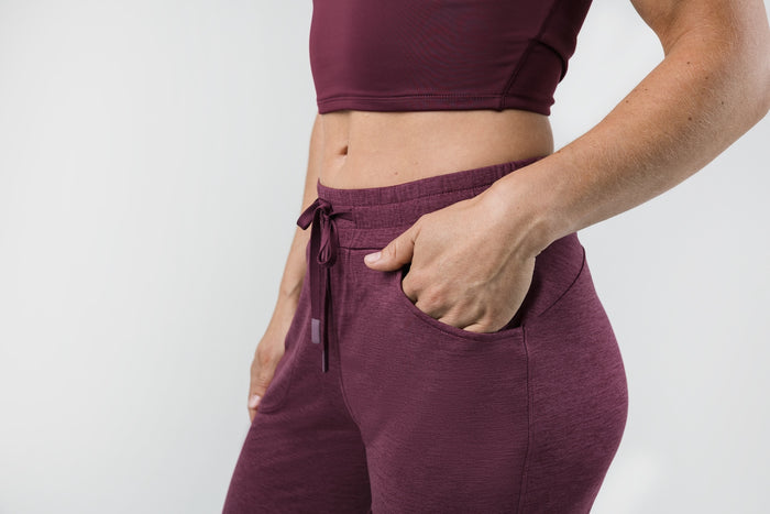 The REP Fitness Women's Vellus Joggers in Heather Wine front, pocket detail