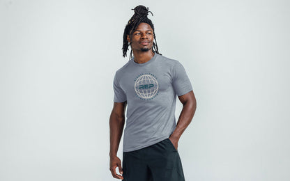 Athlete wearing the REP Fitness Worldwide Tri-Blend Crew T-Shirt in Heather Flint with a gray graphic