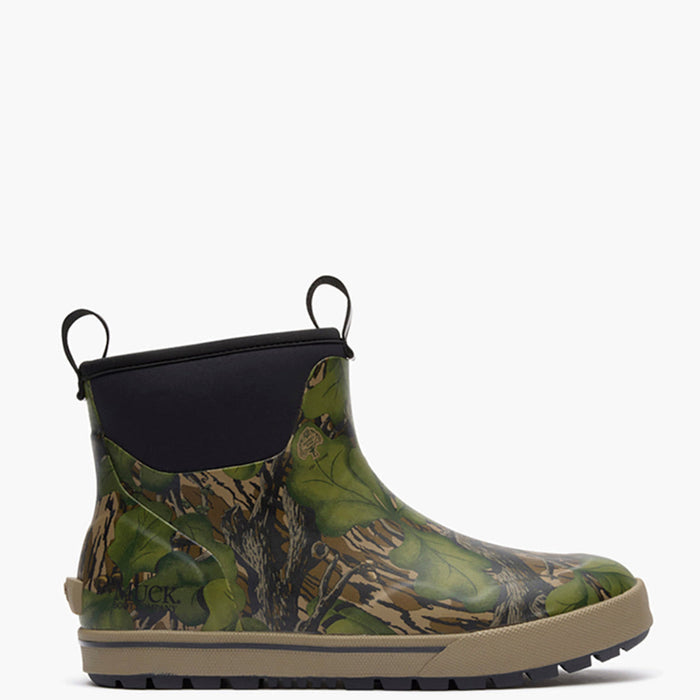 A single ankle-height rubber boot with a green and brown woodland camouflage pattern, a black elastic side panel with a pull tab, and a tan sole, shown against a plain white background.