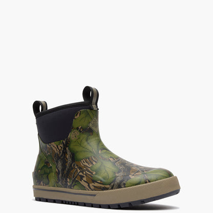Green camouflage boot with a black sole on a white background