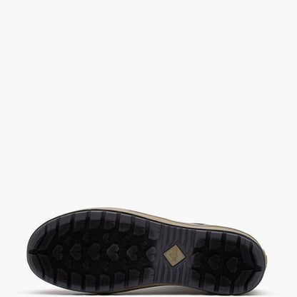 The bottom sole of a black outdoor boot, showing a deep tread pattern and a small tan diamond-shaped logo, set against a plain white background.